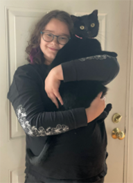 Rowan holding a cat